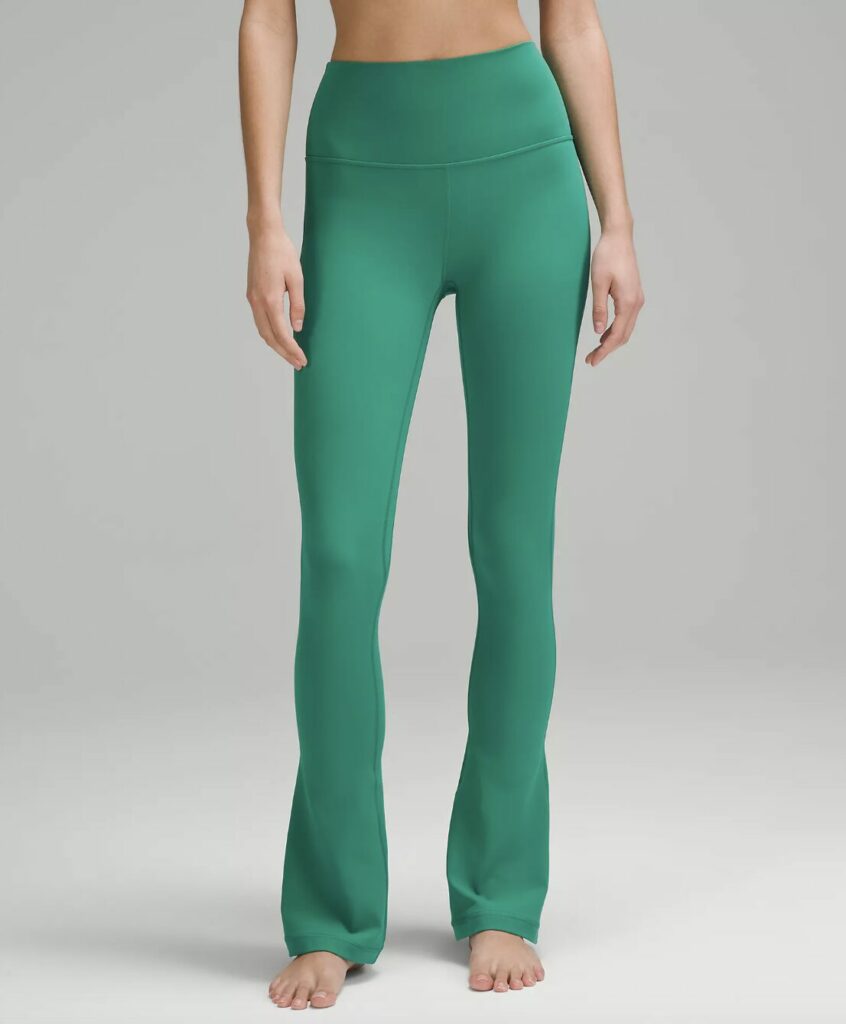 Model wearing lululemon high rise yoga pants in green